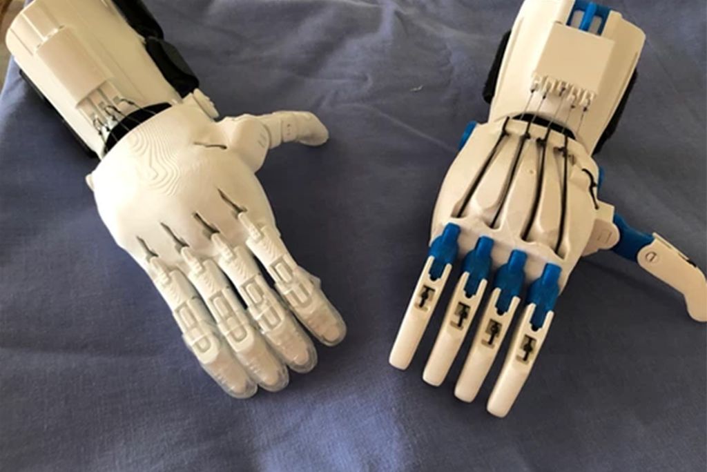 Two of e-NABLE’s Phoenix Hand V3 prosthetic hands, 3D printed by members of Helping Hands MB. Photo taken by David Tamen.