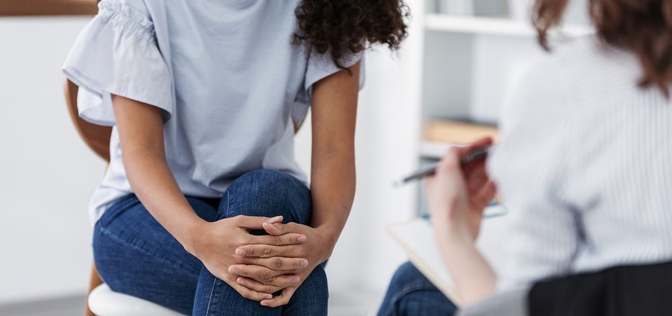 Mental health matters: BU has a wealth of resources to help you on your college journey, in whatever form help means to you. Photo by iStock/KatarzynaBialasiewicz. Photo depicts two individuals sitting across from each other with their legs crossed, having a conversation.
