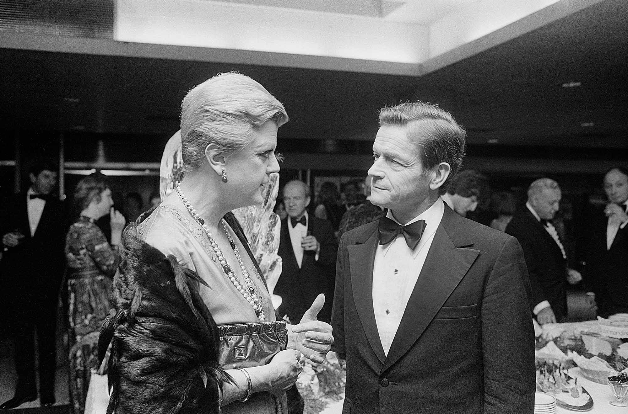 Black and white photo: Lansbury (left) with John Silber (Hon.’95) at a gala celebrating his 10th anniversary as BU president, November 7, 1981.
