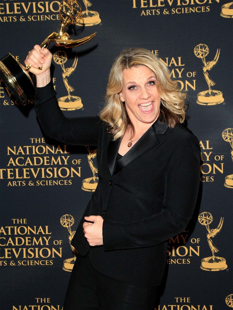 SNL's Liz Patrick holds up an Emmy award