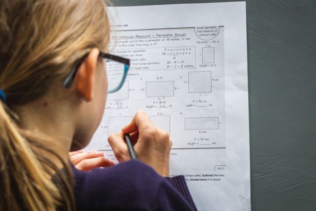 A child taking a math test. Photo by Greg Rosenke/Unsplash