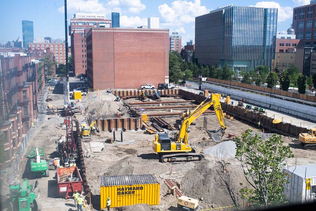 Photo: Construction at the Center for Computing and Data Sciences on August 18, 2020. A large plot of land is full of construction workers and vehicles as the foundation is worked on for the building.