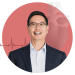 Image of portrait of Chris Chen cropped inside a dark pink circle. He is a middled-aged AAPI man who wears a blue suit, white shirt, and glasses. His portrait is cropped into the circle and at left, is a maroon EKG heart beat line. At top right, is an image of a heart in black and white that has been pixelated.