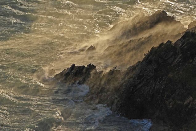 Photo: Waves crash against rocks on a choppy day on Wager Island