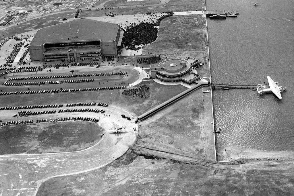 An aerial view of the Pan American Airways terminal (left) and the Marine Air Terminal (right) at LaGuardia Airport, New York, New York, 1940. At the end of a dock on the water a Pan-Am Clipper