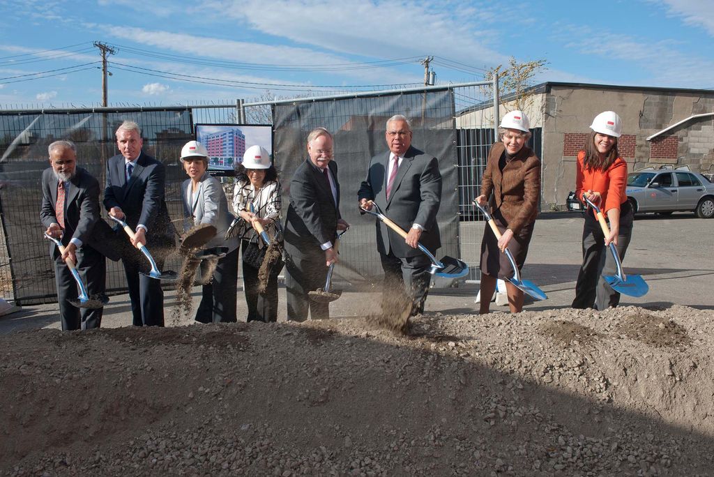 Photo of the groundbreaking for New Boston University School of Medicine. A group of people with shovels and hardhats stand in front of a pile of gray dirt; a green and gray chain link fence is seen behind them. The people seen, left to right, are: Ash Dahod Joe Fallon, Fallon Towle Associates Sherry Leventhal, BUSM Dean’s Advisory Board member Shamim Dahod, CAS'78 CGS'76 MED'87 BUSM Dean’s Advisory Board member and BU Overseer President Robert Brown Mayor Tom Menino Dean Karen Antman Catherine Spina, MED 2015 MD/Phd Candidate.