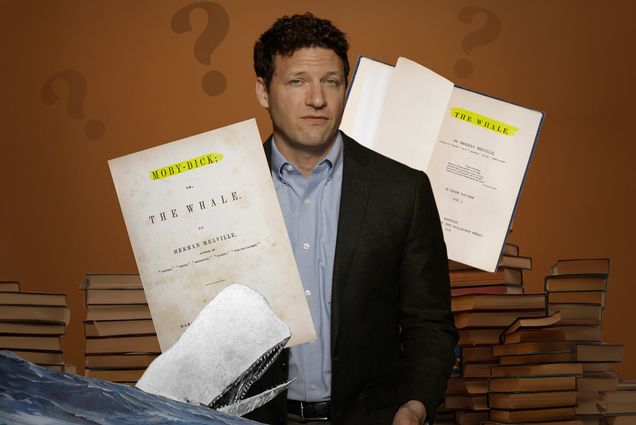 Image: Creative collage features headshot of Joseph Rezek, a white mamn with short curly hair and wearing a light blue colalred shirt and black blazer, old manuscripts of "Moby Dick" and "The Whale" and stacks of older books all on a brown background.