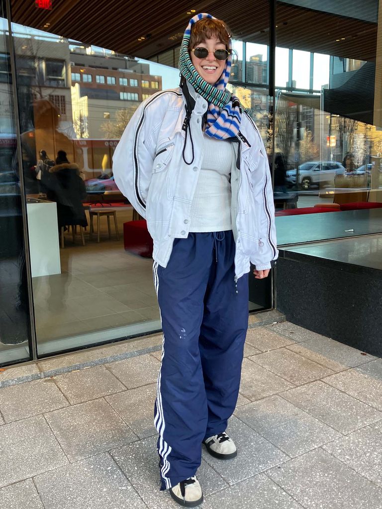 Photo: A college student wearing a bandana and sunglasses, as well as a cardigan and track pants.