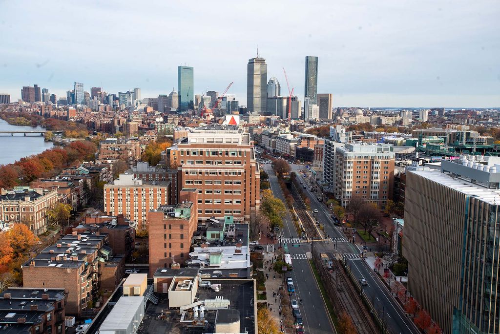 Photo taken from top of the data sciences building looking towards the prudential center and citgo sign, showing the full Boston skyline on a slightly overcast day.