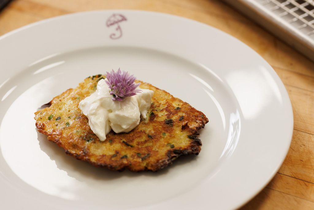 Photo: A shot of Pepin's pancake that he prepared for Mara. Perfectly plated, the pancake is placed in the middle of the plate, dolloped with butter on top and a fancy, pink garnish.