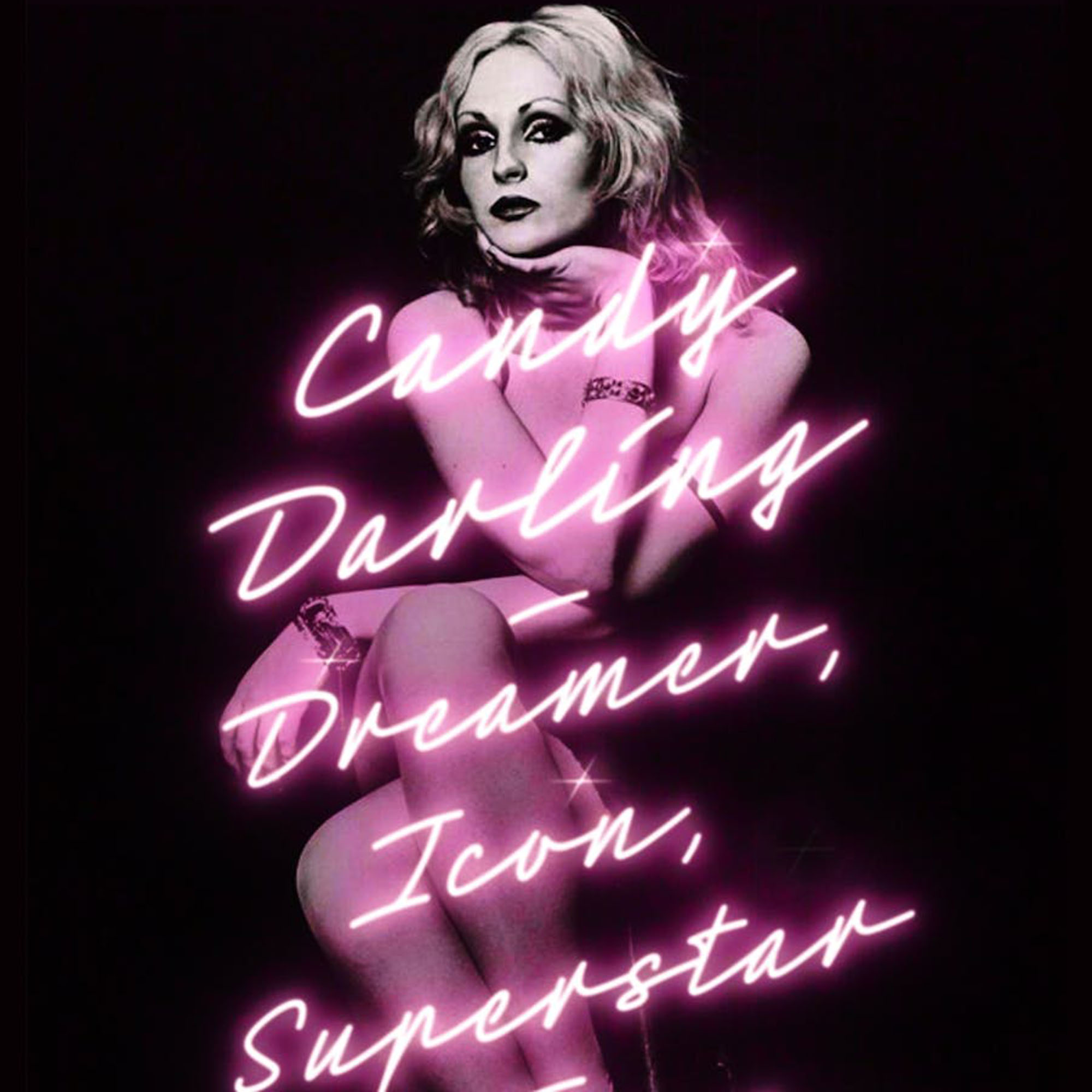 Photo: Book cover of "Candy Darling: Dreamer, Icon, Superstar" by Cynthia Carr. It features black and white picture of a woman with dramatic makeup and a model-style pose. Neon-style pink text reads "Candy Darling: Dreamer, Icon, Superstar"