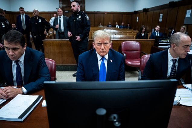 Photo: A man in a blue suit sits in a court room with a dejected look on his face. Former President Donald Trump awaits the start of proceedings during jury selection at Manhattan criminal court, Thursday, April 18, 2024 in New York. (Jabin Botsford/The Washington Post via AP, Pool)