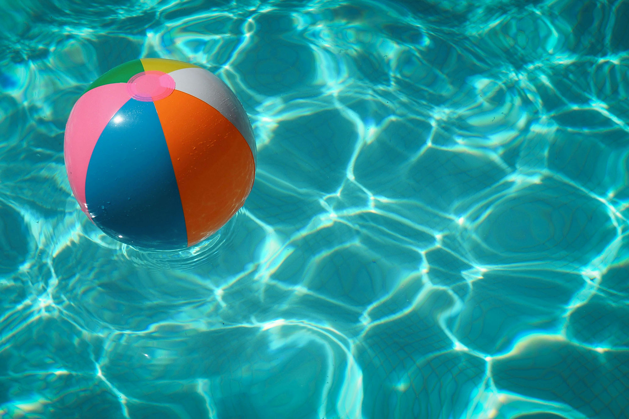 Photo: An inflatable beach ball floating in a pool