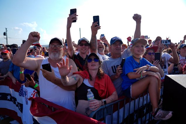 Photo: A crowd of Trump supporters wearing red hats and white and blue clothing at a recent rally in Butler PA
