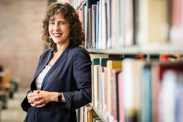 Photo: Jennifer Gunter King, a white woman with short curly hair, poses for a photo