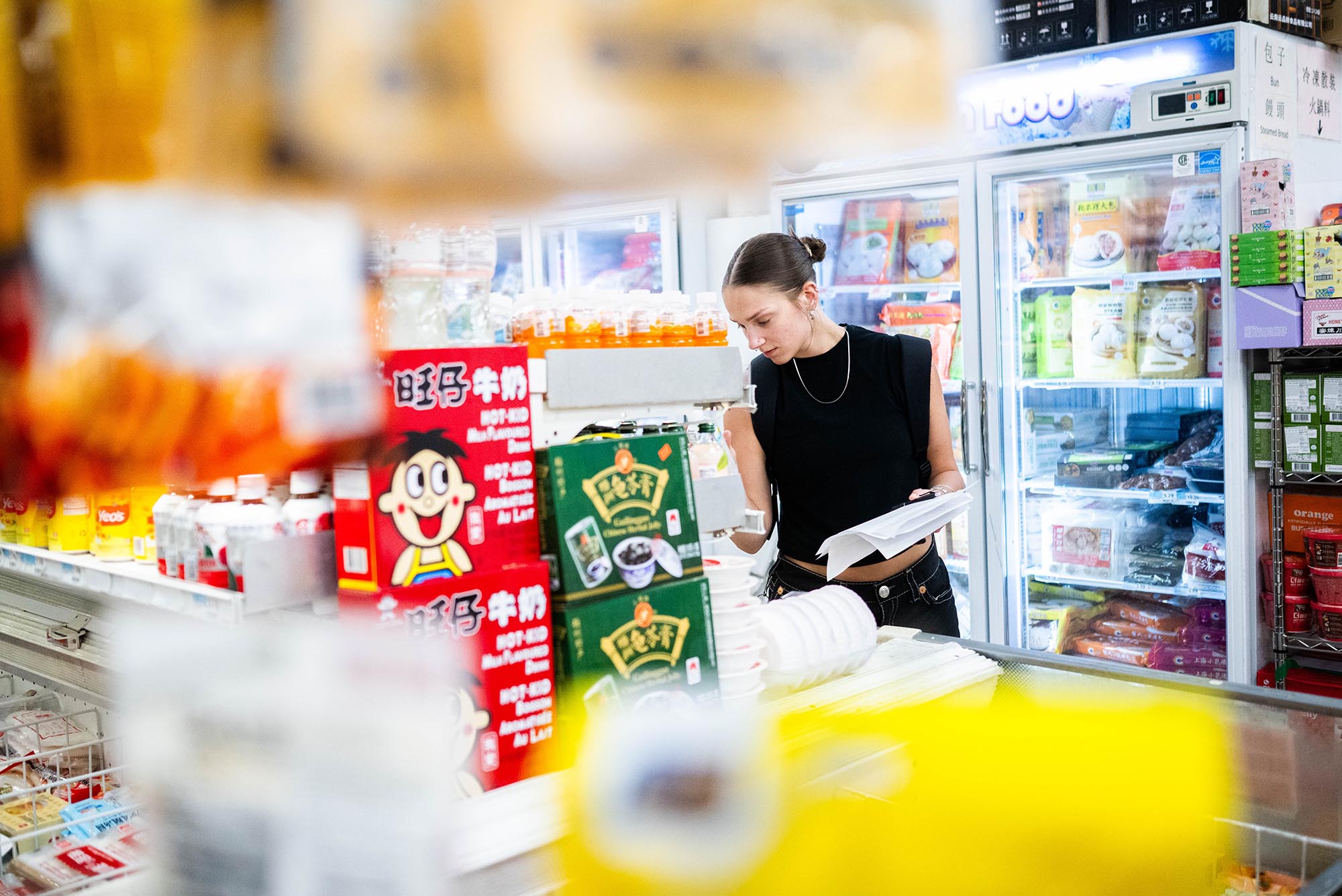 Photo: A lone student explore Jia Ho supermarket in Chinatown during a class “Food in Place(s): Identity, Location, and the Cultures of Taste”