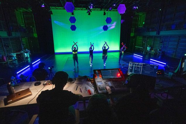 Photo: At the completion of the program, the Brighter Boston team records STOMP performances in the set they built and lit