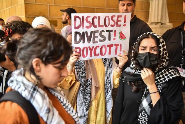 Photo: Students at the American University of Beirut are carrying banners as they attend a pro-Palestinian demonstration on the campus. One reads "DISCLOSE DIVEST BOYCOTT"