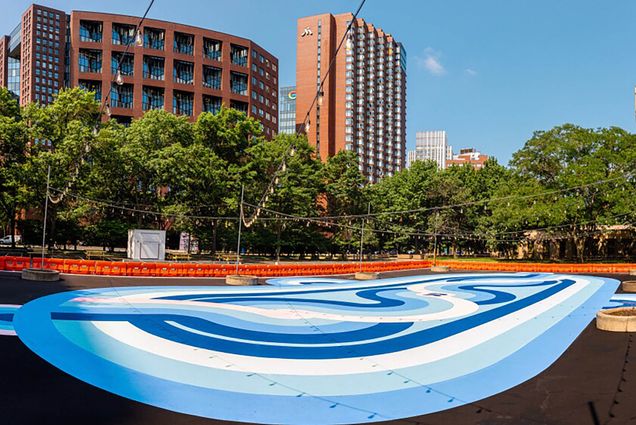 Photo: A wide shot of a makeshift, outdoor roller rink.