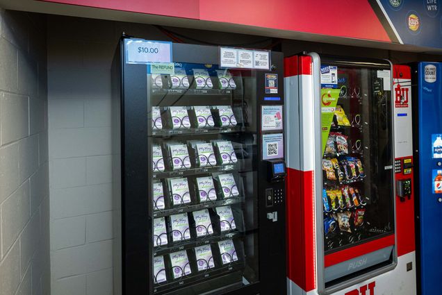 Photo: A black vending machine full of boxes of pills with the words "My Way" on them