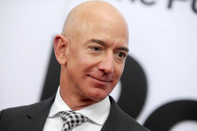 Photo: Jeff Bezos, a bald white man in a suit, poses for a formal headshot