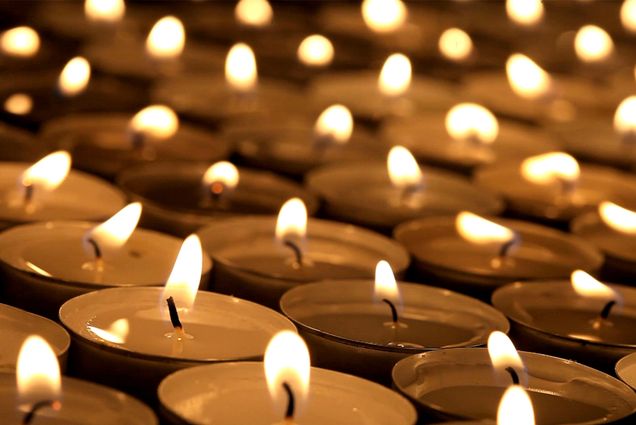 Photo: a large sea of tea lights at a candlelight vigil