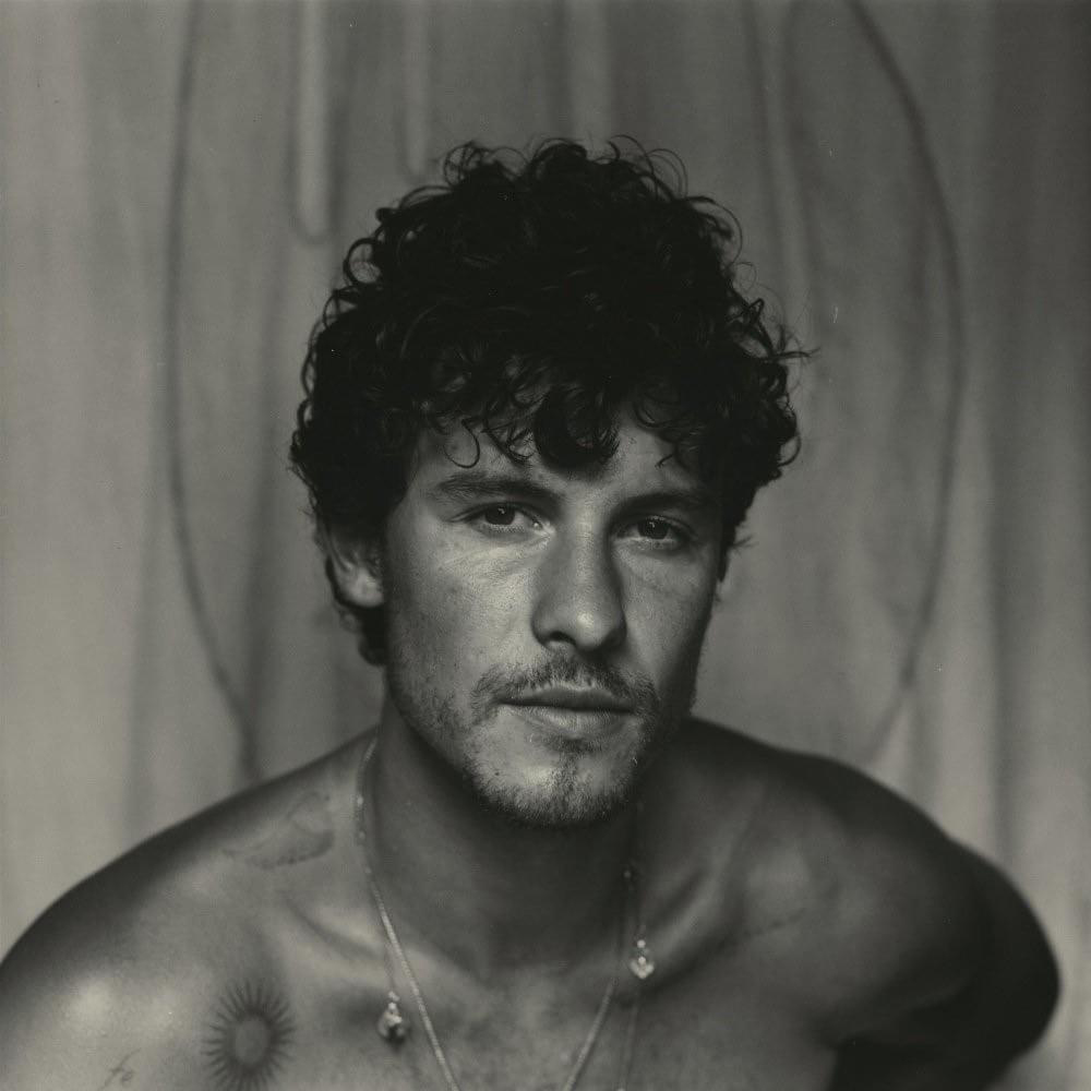 Photo: A black and white image of Shawn Mendes, shirtless with his hair in disarray