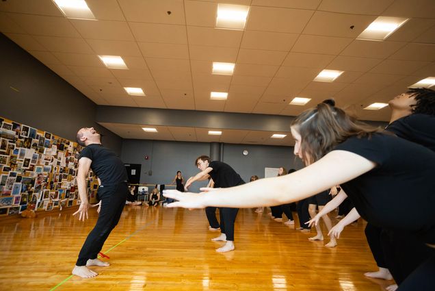 Photo: Yo-El leads his class in body movements in a studio.