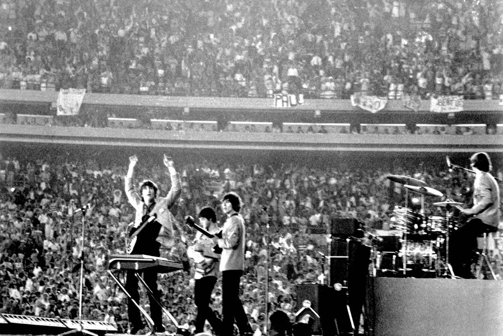 Photo: A black and white photo of The Beatles playing at Shea Stadium in New York