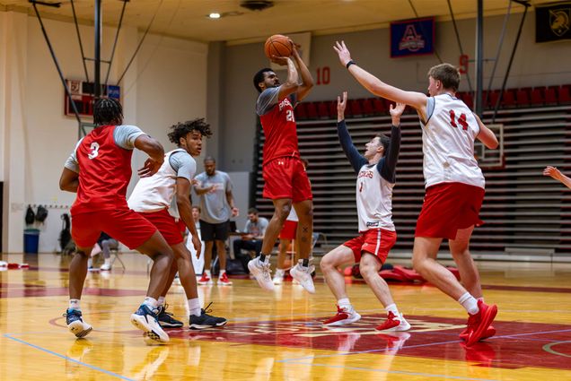 Photo: A basketball player in a red jersey takes a shot in a practice game at Boston University