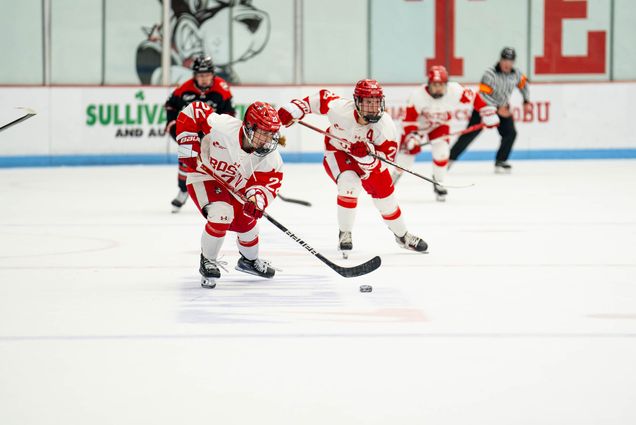 Photo: Christina Vote (CAS'25) on the Boston University Women's Ice Hockey team skates towards the goal during a game against Northeastern University at the opening game of the season