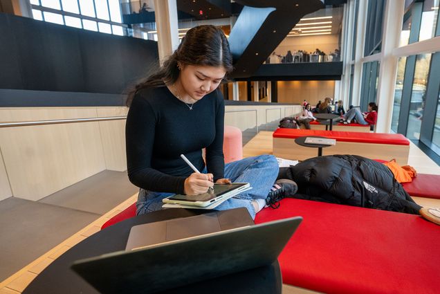 Photo: A female student studying in the CDS building at Boston University
