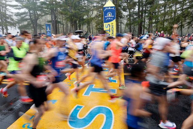 Runners cross the starting line during the 127th Boston Marathon, Monday, April 17, 2023, in Hopkinton, Mass. (AP Photo/Mary Schwalm)