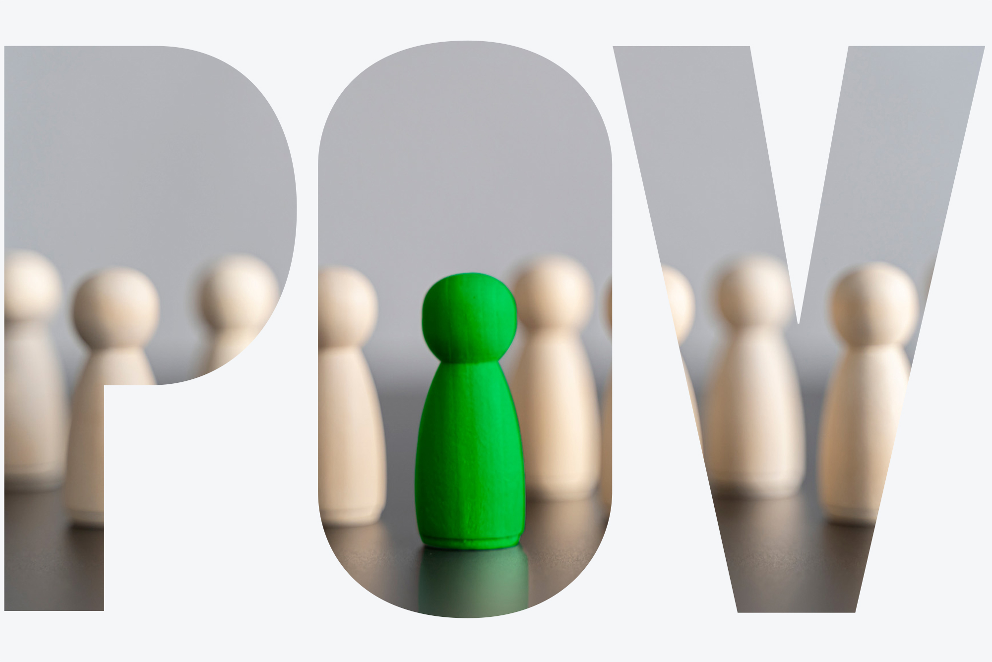 Photo: Wooden pieces of the same color on a table with one green piece in the middle. There is an overlay with the letters "POV" on the image