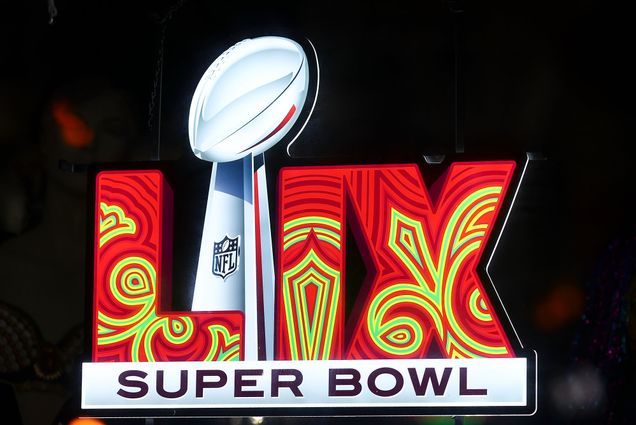 Photo: The logo for Super Bowl LIX, which features the roman numerals in a red and green pattern with a Lombardi trophy in the middle
