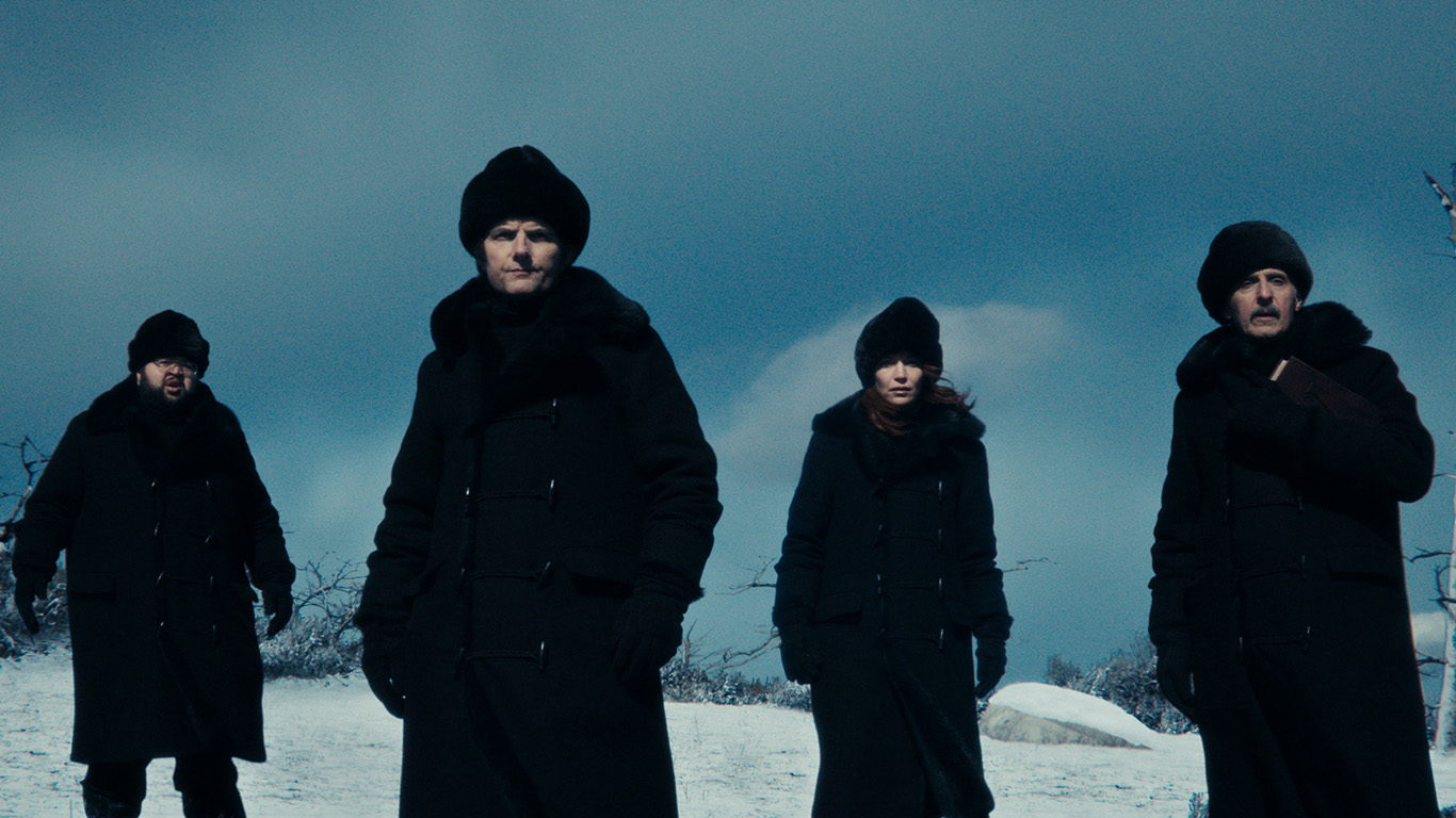 Photo: A still from Apple TV+'s show "Severance" with four characters in winter gear in front of a snowy scene