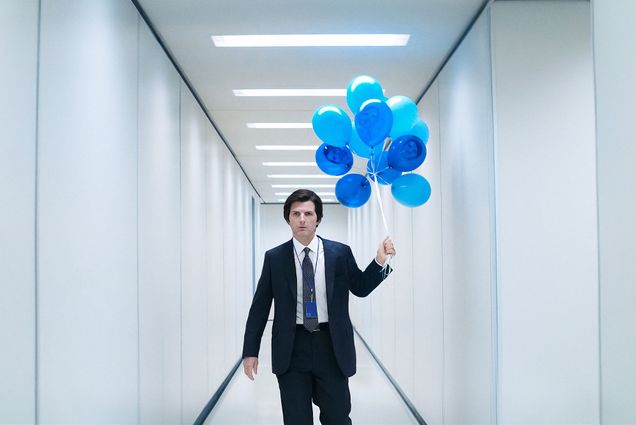 Photo: A still from the show "Severance" with Adam Scott carrying a bunch of blue balloons