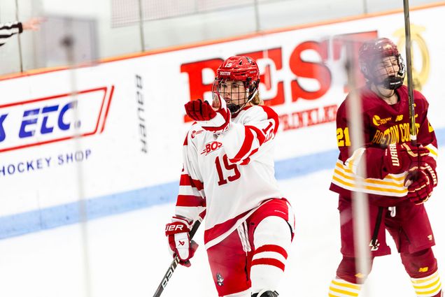 Photo: A female hockey player celebrating a goal on the ice