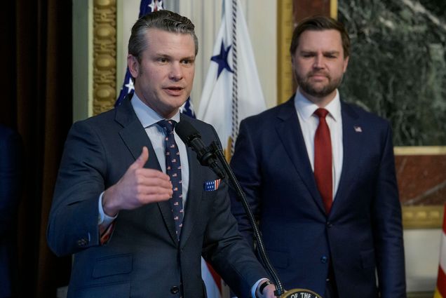 Photo: Pete Hegseth at a podium with VP JD Vance behind him