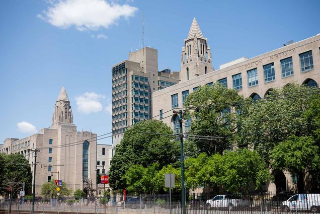 Photo: A stock image of Boston University's campus with bright blue skies and greenery.