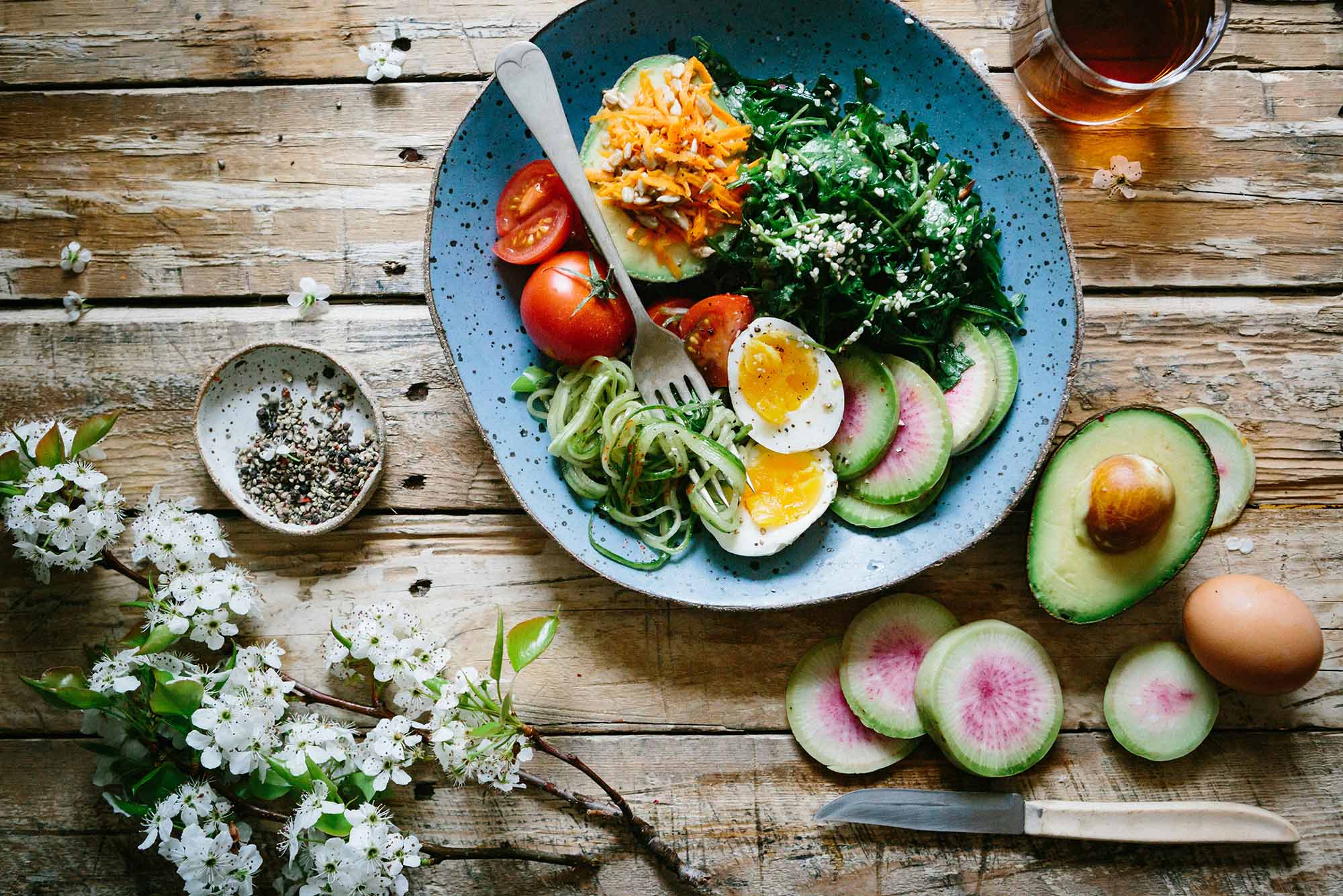 Photo: A stock image of a full plate with greens, fruits, and boiled eggs.