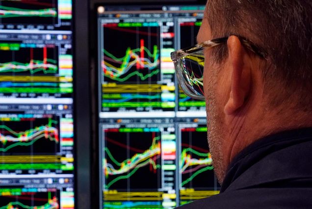 Photo: A specialist works at his post on the floor of the New York Stock Exchange