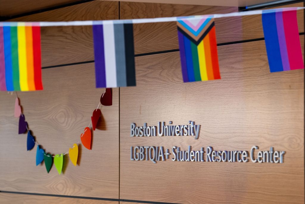 Photo: The 波士顿大学 LGBTQIA+ Student Resource Center decorated with flags, including a Progress Pride flag