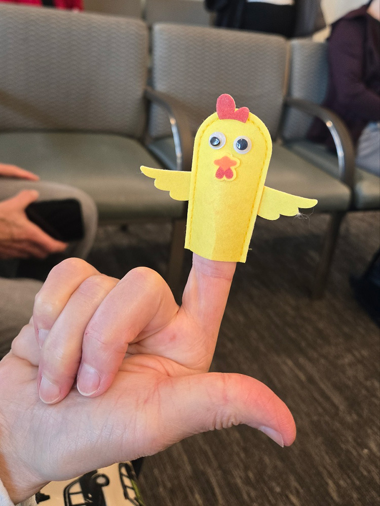 Photo: A small finger puppet of a chicken