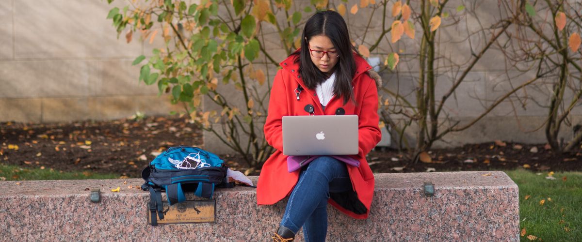 CAS Student on Laptop