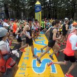 Runners cross the start line of the 123rd Boston Marathon on Monday, April 15, 2019, in Hopkinton, Mass.