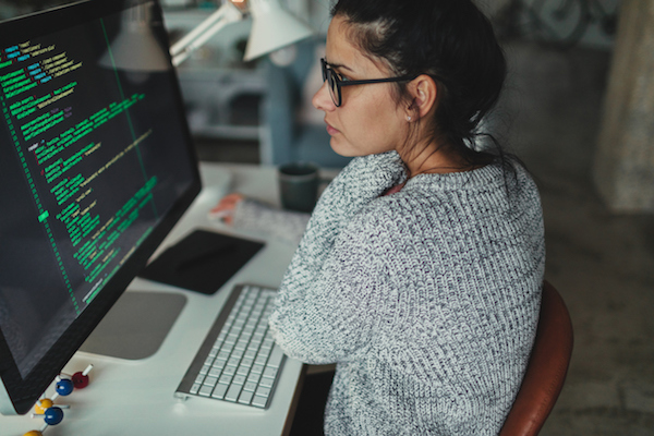 Girl programming at desk