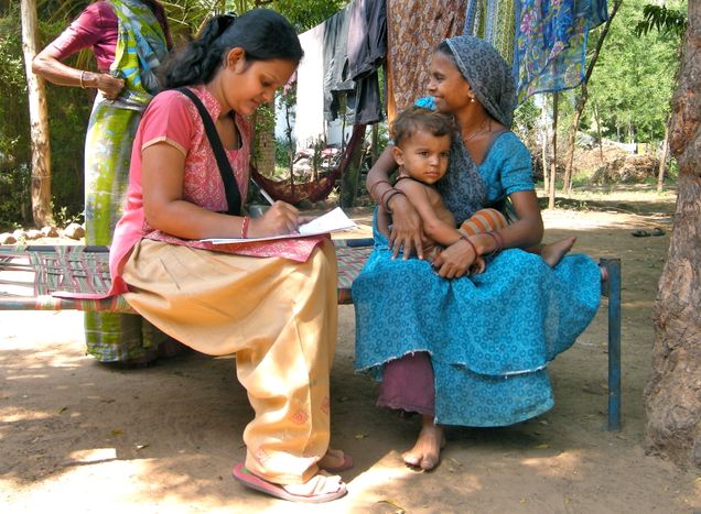 An interviewer conducting a survey in sim-vistar of Padgol village An interviewer conducting a survey in sim-vistar of Padgol village