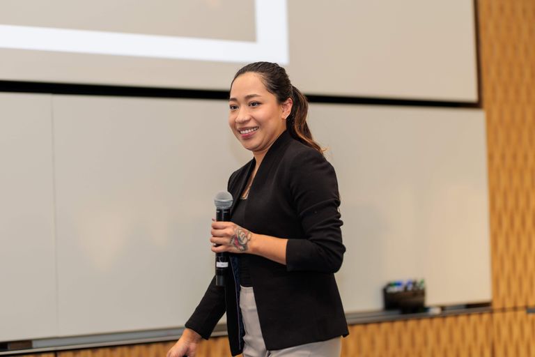 A student smiling after pitching at a competition