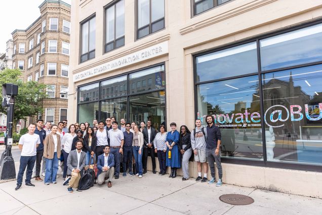 Group photo of students and employees standing outside IDG Capital Innovation Center